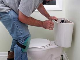 one of our Federal Way plumbers is installing a toilet